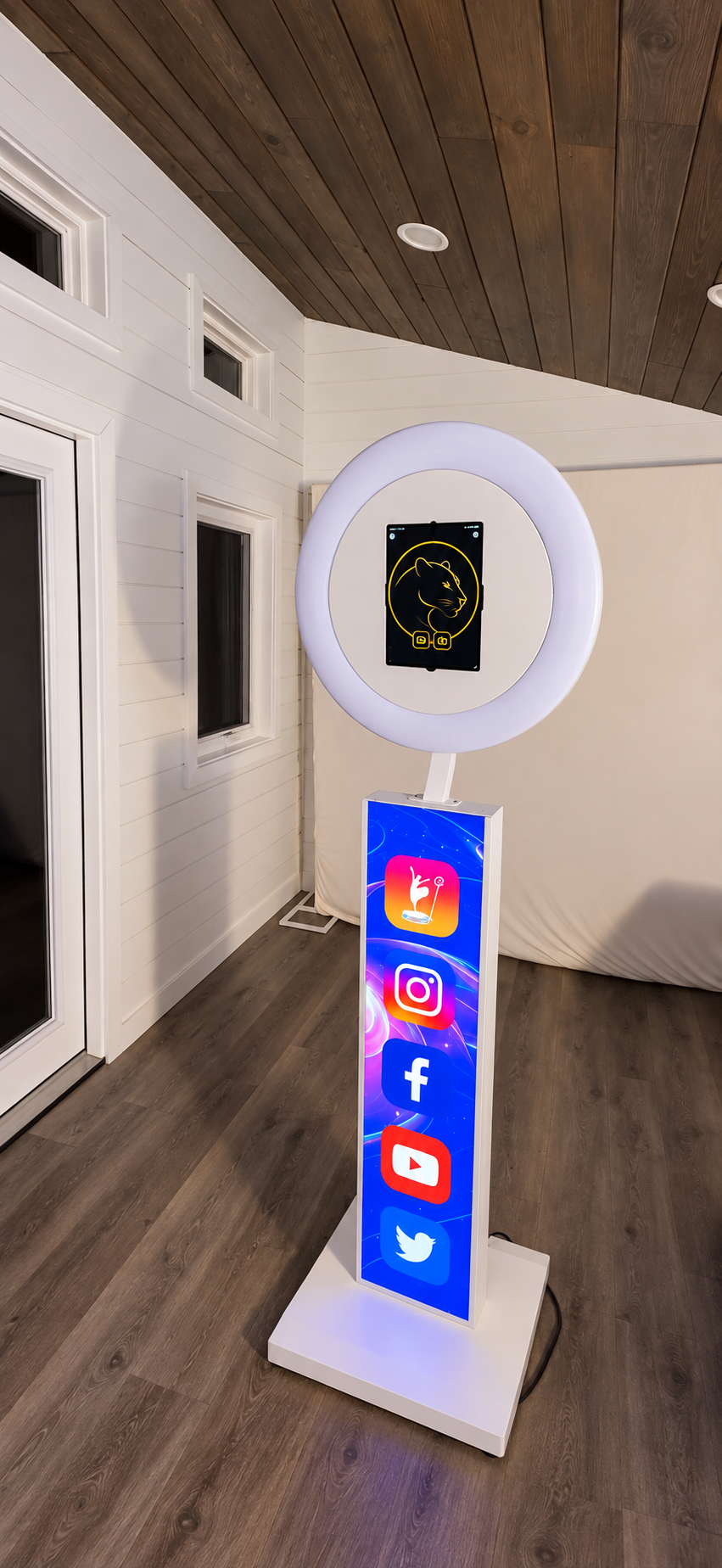 Knox & Noble white ring-light photo booth with its gold logo and illuminated screen